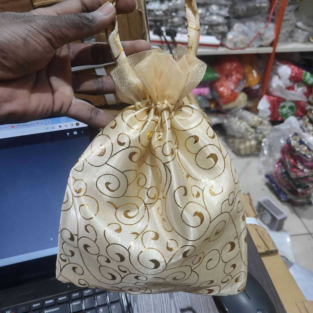 CREAM FLORAL POTLI BAG