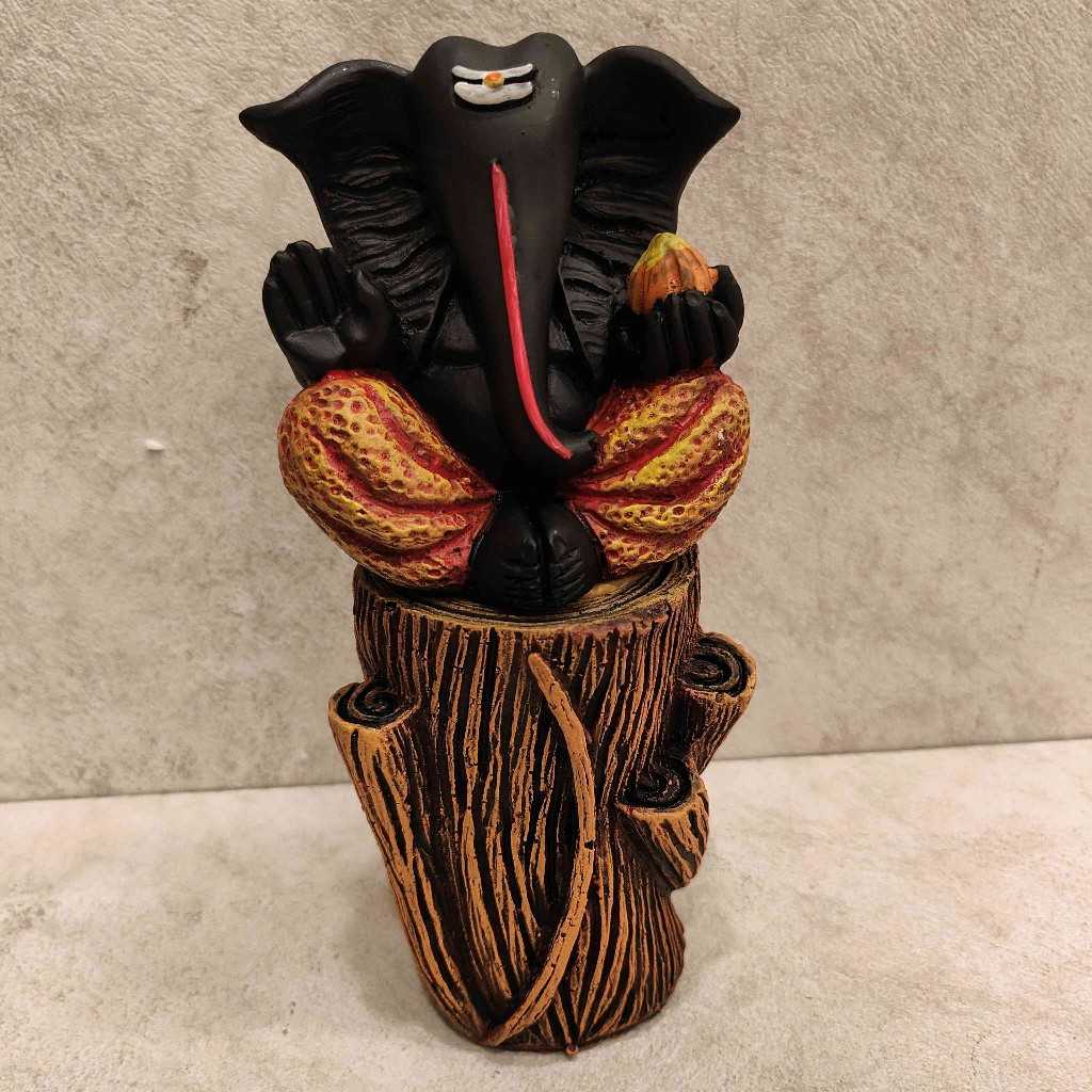 Ganesh sitting Log Orange Black