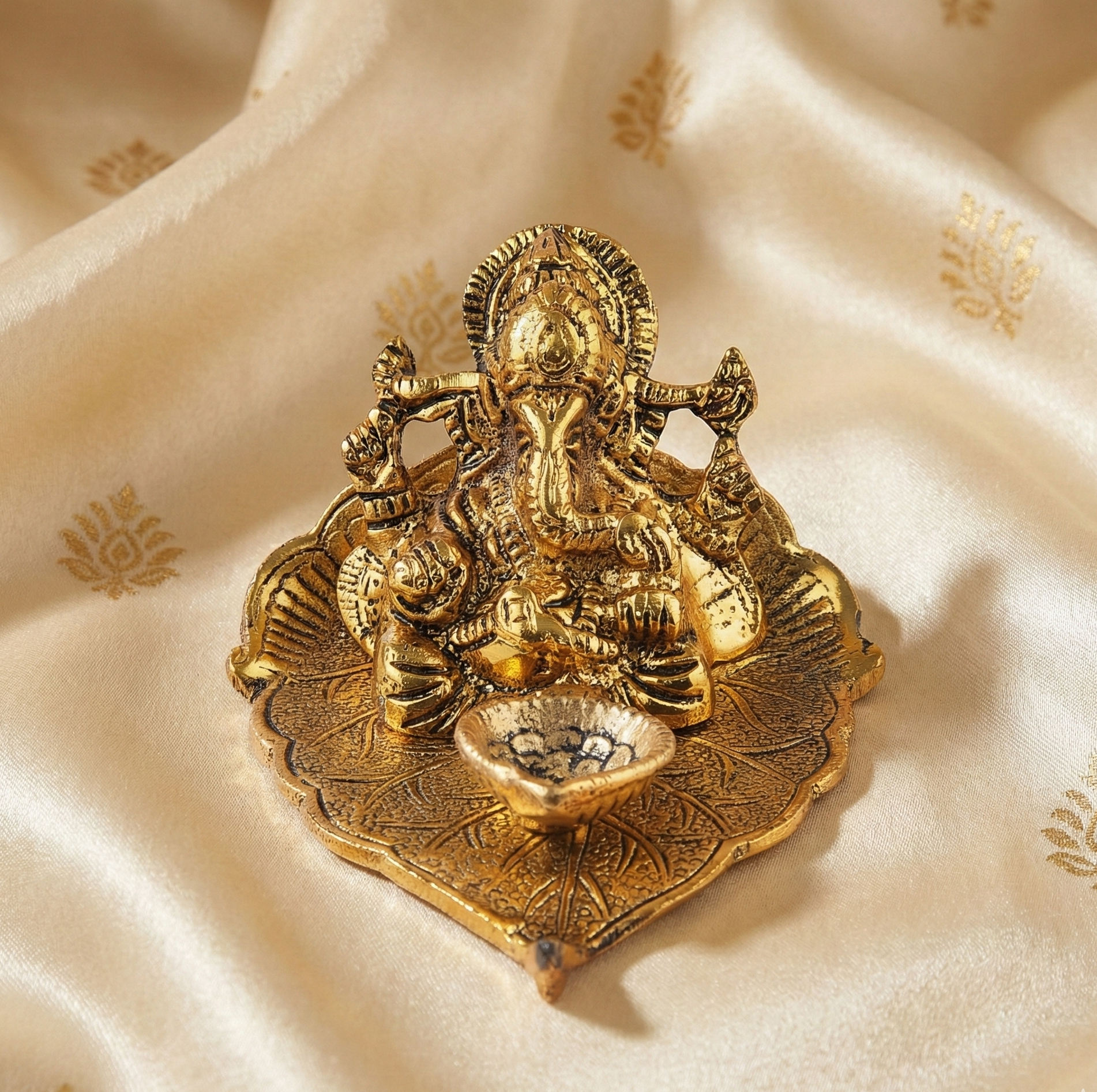 Golden plated leaf Ganesh Idol