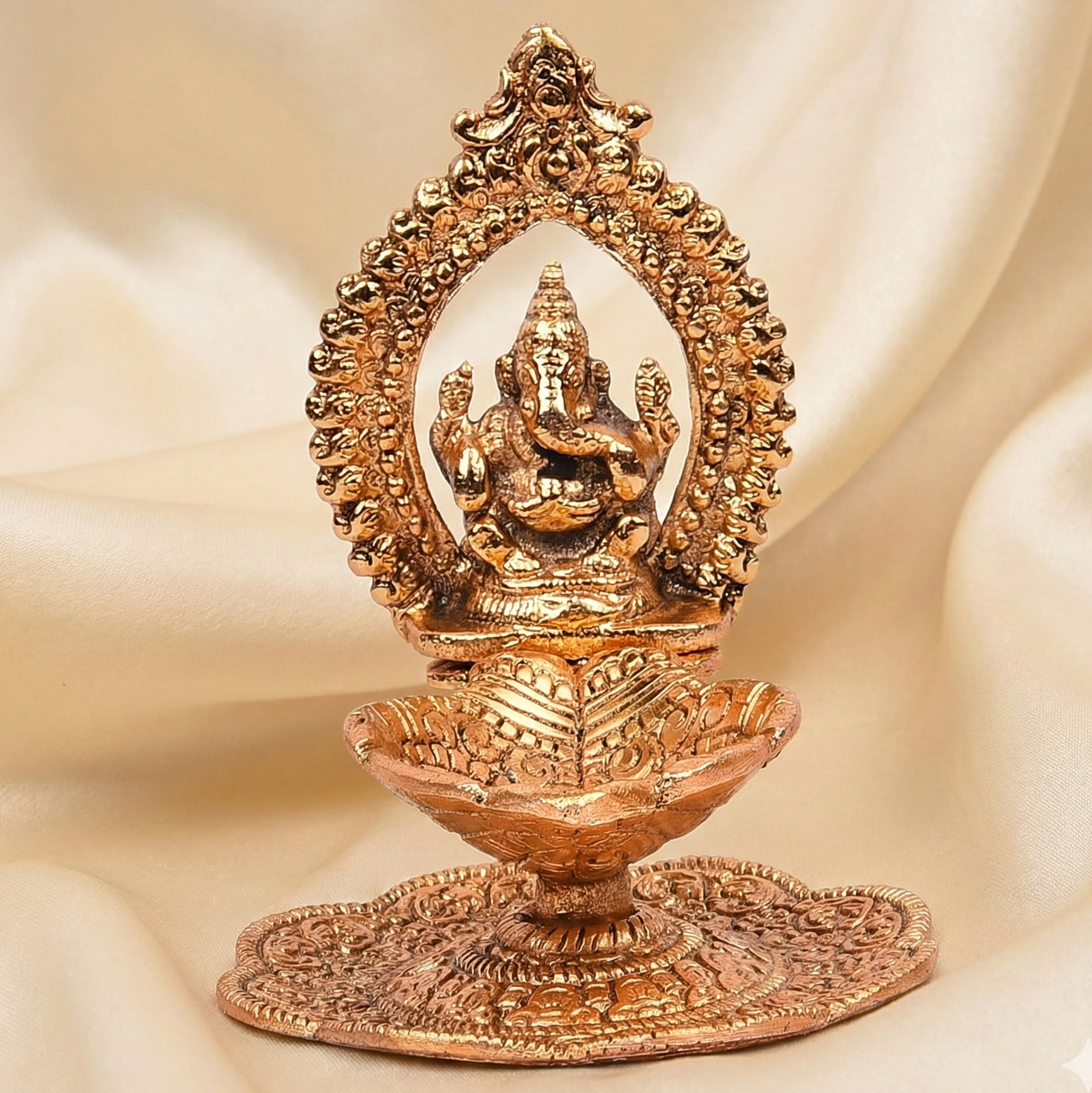 golden antique ganesh diya return gift